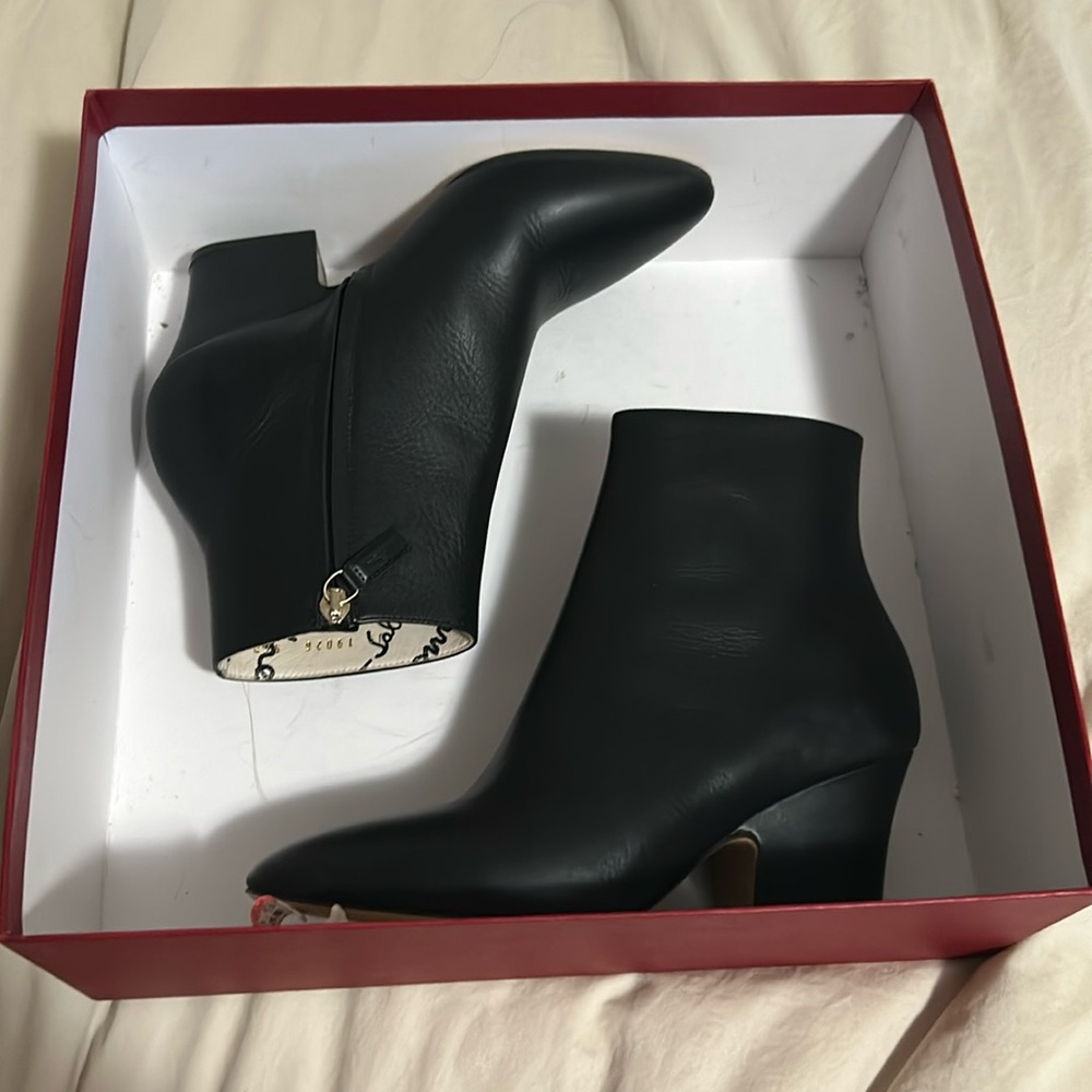 New/ unused Ferragammo booties.  5.5.  Cloth Shoe bag not included.